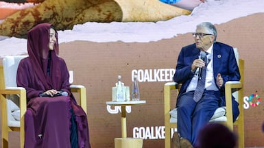 Bill Gates and Reem Al Hashimy, Minister of State for International Co-operation, in conversation. Victor Besa / The National