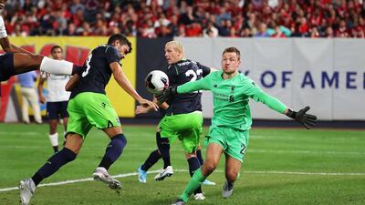 Liverpool goalkeeper Simon Mignolet makes a save. AFP