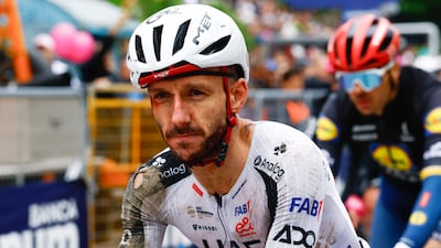 Bloodied and bruised UAE Team Emirates-XRG rider Adam Yates crossing the finish line after a crash on Stage 2 of the Giro d'Italia 2026. AFP