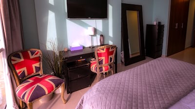Union Jack patterns adorn the seats in this room despite the fact the apartment's owner is French.