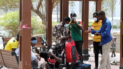 The homeless and jobless people from Ghana gather at a park in Dubai's Satwa district. Chris Whiteoak / The National