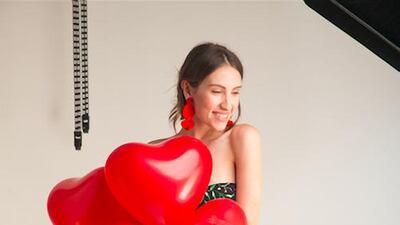 A model dressed in Mochi’s Spanish collection, with heart-shaped balloons for Valentine’s Day. Courtesy of Mochi