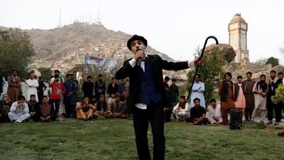Karim Asir performs in a school at Kabul Zoo. Reuters