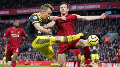 Liverpool's Andrew Robertson, right, challenges Southampton's James Ward-Prowse on Saturday. AP