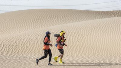 Ayesha Ahmed Foolad and Ahmed Al Kathiri trying the new routes for Al Marmoon Ultramarathon at Al Qudra. Ruel Pableo for The National