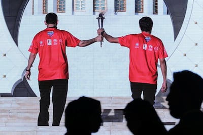 Athletes carry the Special Olympics torch on Tuesday evening. Chris Whiteoak / The National
