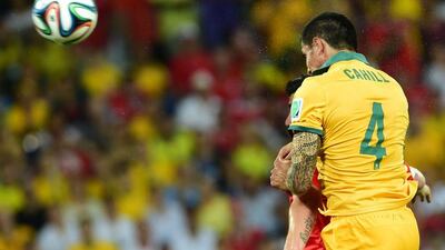 Tim Cahill heads and scores to bring Australia within 2-1 against Chile on Friday night at the 2014 World Cup in Cuiaba, Brazil. Martin Bernetti / AFP