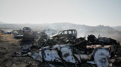 Cars smoulder after Israeli settlers set fire to a scrapyard in Hawara, near the occupied West Bank city of Nablus. AP
