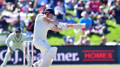 England's Alastair Cook (C) bats, watched by New Zealand's Tom Latham (L) during day three of the second cricket Test match between New Zealand and England at Hagley Oval in Christchurch on April 1, 2018. Marty Melville / AFP