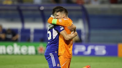 Dinamo Zagreb's Dino Peric celebrates with Dominik Livakovic after the 1-0 Champions League victory against Chelsea on September 6, which turned out to be Thomas Tuchel's last match as manager. Reuters