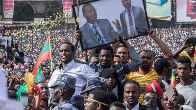 Supporters of Ethiopia Prime Minister Abiy Ahmed attend a rally on Meskel Square in Addis Ababa. Mr Ahmed believes that by developing the country's natural resources, Ethiopia will be a middle-income economy by 2025. Yonas Tadesse/AFP