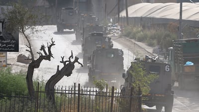 Israeli military vehicles in convoy during a raid on Far'a refugee camp in the occupied West Bank on Monday. EPA