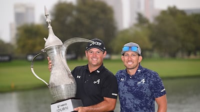 Patrick Reed with his caddie Kessler Karain after winning the Dubai Desert Classic. Getty Images