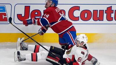 Montreal's Tomas Plekanec collides with Ottawa's Erik Karlsson.