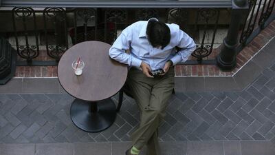 Social media brings people together and, experts say, can heighten competition between individuals to the point that some have ended up heavily in debt. Antonie Robertson / The National