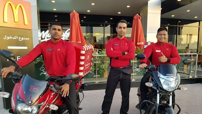 Sanal Pchikaran, Mohammed Zubari and Jhomar Dizon, delivery riders at the McDonald’s branch in Jumeirah, Dubai.