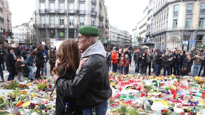 Belgians pay tribute to victims of the terror attacks in Brussels. Nicolas Maeterlinck / AFP