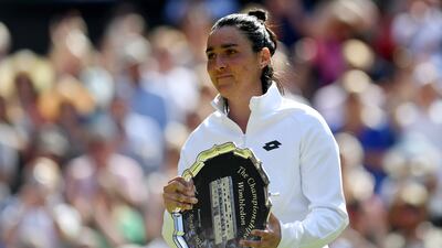 Tunisia's Ons Jabeur poses with her runner-up trophy after the women's final at the Wimbledon tennis championships on Saturday. EPA