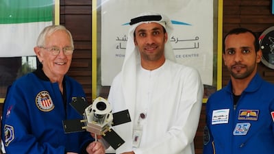 Former US astronaut Charles Duke meets Salem Al Marri, deputy director general of Mohammed bin Rashid Space Centre, and Emirati astronaut Hazza Al Mansouri. Photo: MBRSC