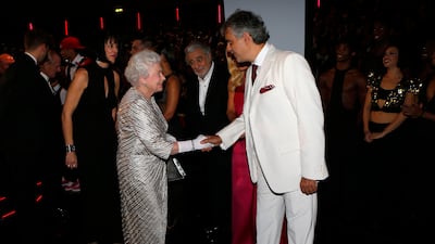 Queen Elizabeth greets singer Andrea Bocelli. Getty