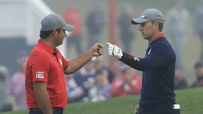 USA’s Patrick Reed fist bumps teammate Jordan Spieth on the first hole during morning foursomes at the Ryder Cup. David J Phillip / AP Photo
