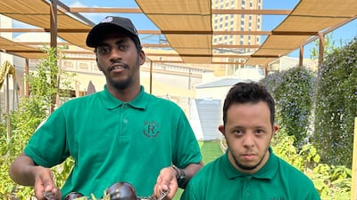 Ali Abdeulmajeed, left, and Ezzeldin Esam are students in the gardening workshop.