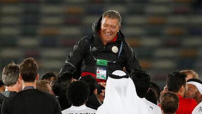 All Jazira coach Henk ten Cate is lifted in the air by his players and club officials after their Club World Cup win over Urawa Red Diamonds on Saturday. Matthew Childs / Reuters