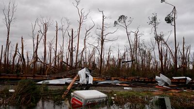 Shredded trees, derailed train cars and a sunken trailer are seen in the aftermath of Hurricane Michael in Panama City, Florida. AP Photo