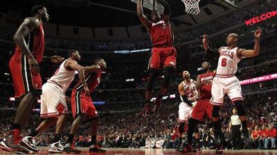 Miami's Dwyane Wade controls a rebound against the Chicago Bulls in Game Five of the Eastern Conference finals on Thursday. His late charge helped the Heat to a 83-80 victory to send his side to the NBA Finals, where they will face the Dallas Mavericks.