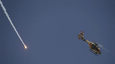 An army helicopter fires a weapon as Iraqi forces battle ISIL fighters in western Mosul on March 12, 2017. Zohra Bensemra / Reuters