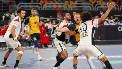 Sweden's centre back Jim Gottfridsson is challenged by Egypt's left back Ali Zein, right, and Yehia Elderaa. AFP