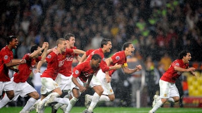 Manchester United players celebrate victory after Chelsea's Nicolas Anelka misses his penalty.