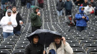 Spectators with umbrella's during a rain delay on Day 1 of the fourth Ashes Test between England and Australia at Old Trafford, Manchester. Reuters