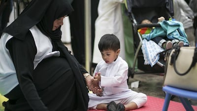 A boy colours at the colouring station set up as part of Down Syndrome Day celebrations at Yas Mall. Mona Al Marzooqi/ The National