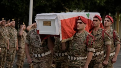 Soldiers carry the coffin of Mohammad Shuqair, wrapped in the national flag, during his funeral procession at the Lebanese army hospital in Beirut on Sunday. AP