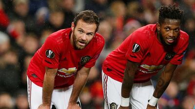 Manchester United's Juan Mata, left, and Fred take a breather. Reuters