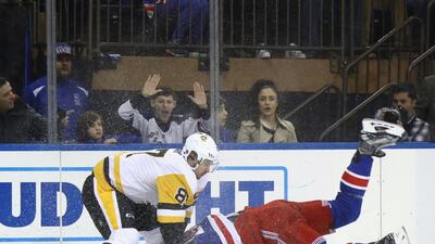 Sidney Crosby of the Pittsburgh Penguins roughs up Ryan McDonagh of the New York Rangers at Madison Square Garden on November 23, 2016 in New York City. Bruce Bennett / AFP