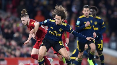 Arsenal's Matteo Guendouzi, centre, and Harvey Elliott of Liverpool. Getty