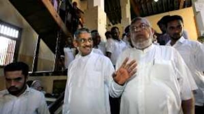 The former general Sarath Fonseka, centre, arrives in Kandy for his election campaign.