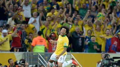 Celebrations for Brazil started early, perhaps even before the match ended. Marcelo, the home team's defender, jumps in joy after their third goal buried any comeback hopes for the world champions. Lluis Gene / AFP
