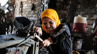 Ms Zanaty, 50, at work in Kafr El Sheikh. Reuters