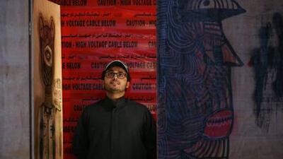 Rami Farook, the owner of Traffic gallery in Dubai, with one of the pieces from his personal collection, 'Vandalism Is What Idealism Does' by local artist Ubik.