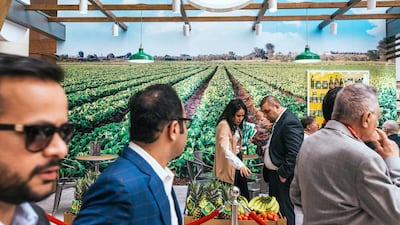 Visitors view the Del Monte stand at Gulfood.