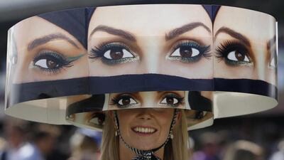 A female spectator during a hat presentation. Ali Haider/ EPA