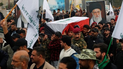 Members of the Popular Mobilisation Forces carry the coffin of a commander killed in a strike in western Iraq. AFP