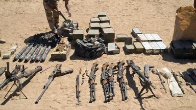 A photo released by the French army shows weapons and ammunition seized in northern Mali. AP Photo