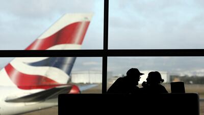 A British Airways aircraft prepares to take off as passengers wait in Cape Town International Airport in Cape Town, South Africa. Reuters