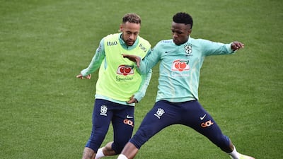 Neymar and Vinicius Junior battle for the ball during training as Brazil continue their World Cup preparations in Italy. Reuters