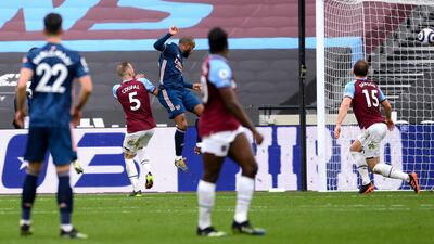 Arsenal's Alexandre Lacazette scores their side's third goal. PA