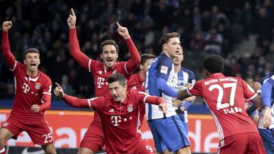 Bayern Munich players celebrate Robert Lewandowski's goal, centre, against Hertha Berlin at the Berlin Olympiastadion on February 18, 2017. Axel Schmidt / Reuters